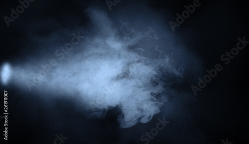 Blue studio spotlight . Stage with smoke on isolated background. Design element.