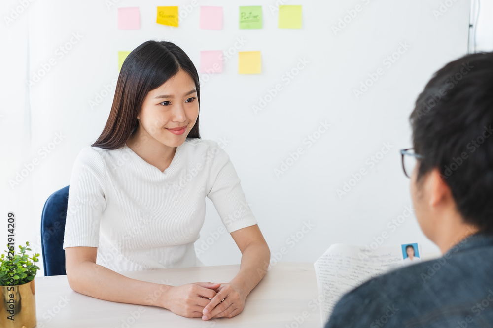 Asian business woman discussing/job interview with colleauge/boss for business meeting Asian business woman discussing/job interview with colleauge/boss for business meeting