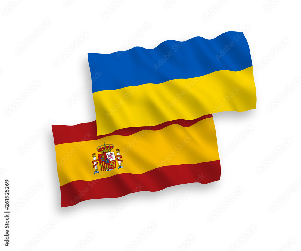 National vector fabric wave flags of Spain and Ukraine isolated on white background. 1 to 2 proportion. National vector fabric wave flags of Spain and Ukraine isolated on white background. 1 to 2 proportion.