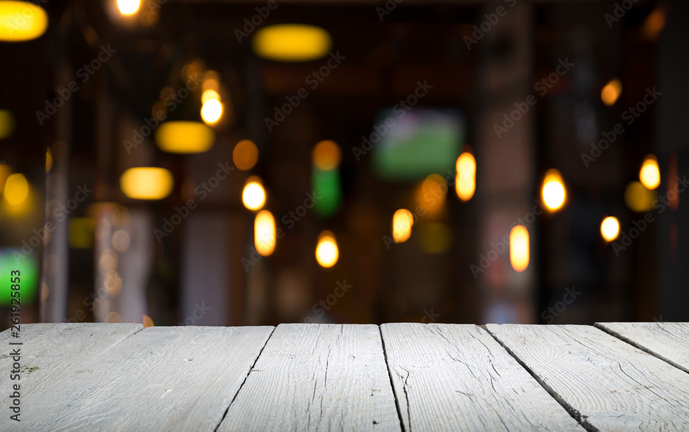 blurred background of bar and dark brown desk space of retro wood
