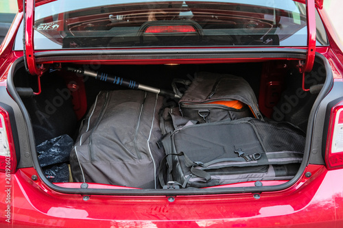 Moscow, Russia - April, 15, 2019: bag, suitcase and other luggage in the open trunk of the red car Renault Logan Stepway