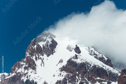 Kazbegi, Georgia - Jun 29 2018: Mount Kazbek (5047m). a famous landscape in Kazbegi, Mtskheta-Mtianeti, Georgia. © beibaoke