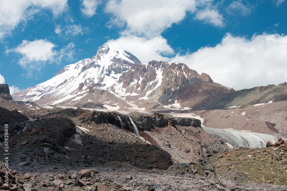 Kazbegi, Georgia - Jun 29 2018: Mount Kazbek (5047m) at Gergeti Glacier. a famous landscape in Kazbegi, Mtskheta-Mtianeti, Georgia.