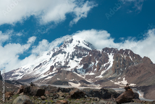 Kazbegi, Georgia - Jun 29 2018: Mount Kazbek (5047m) at Gergeti Glacier. a famous landscape in Kazbegi, Mtskheta-Mtianeti, Georgia. © beibaoke