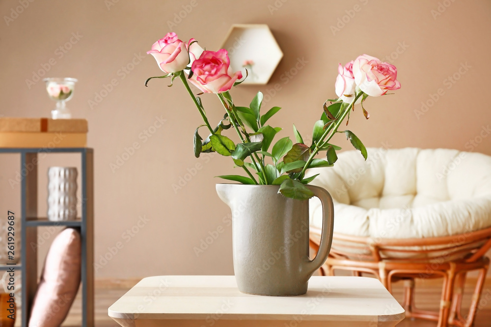 Vase with beautiful flowers on table in room Vase with beautiful flowers on table in room