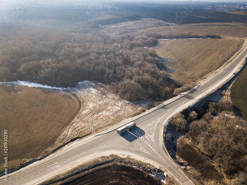 Aerial Top View of highway intersection junction summer morning with car