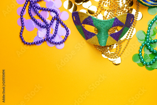 Festive mask with decor on color background