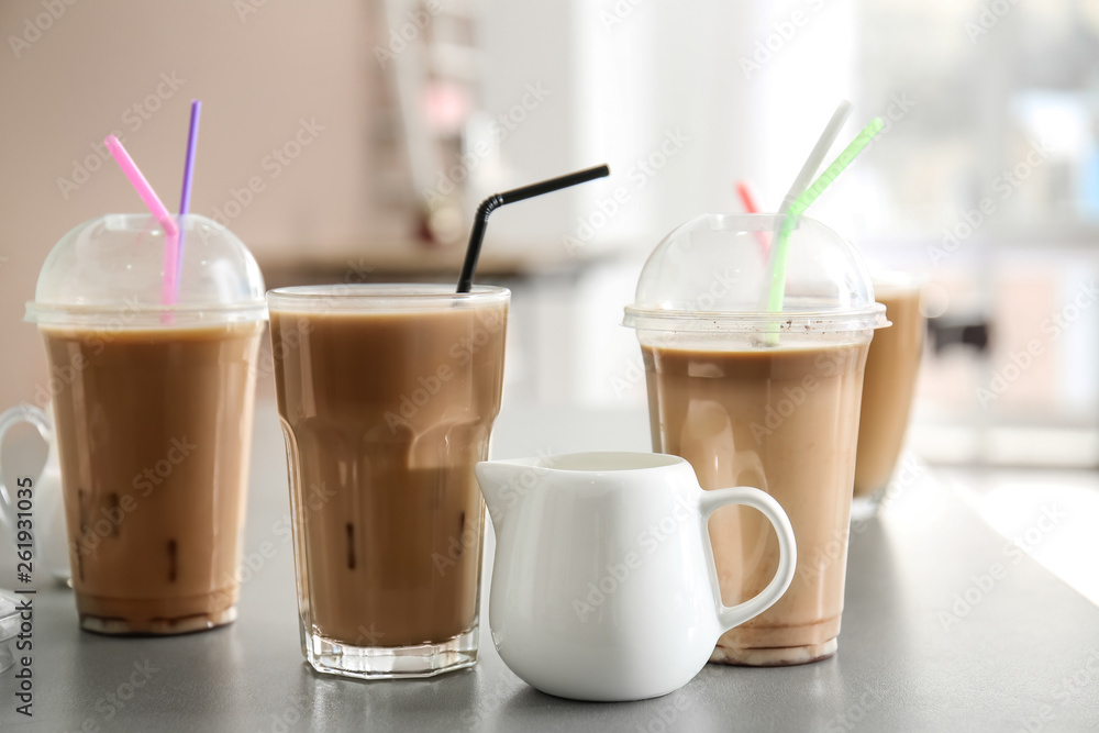 Tasty frappe coffee with milk on table Tasty frappe coffee with milk on table