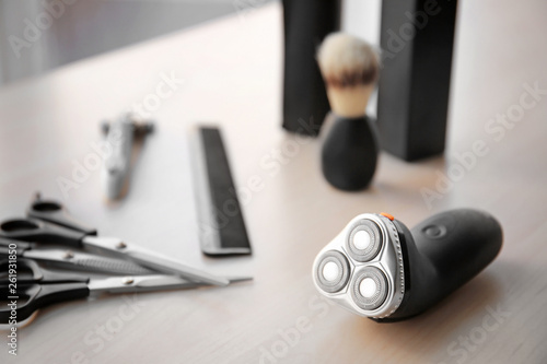 Electric shaver with tools on table