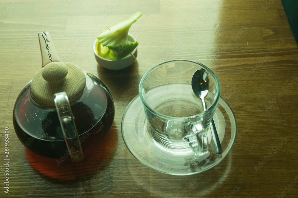 glass teapot glass cups and lemon brown table glass teapot glass cups and lemon brown table