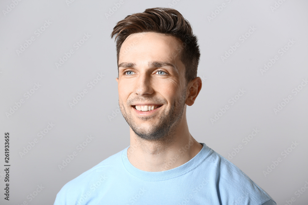 Fototapeta premium Portrait of handsome man on grey background