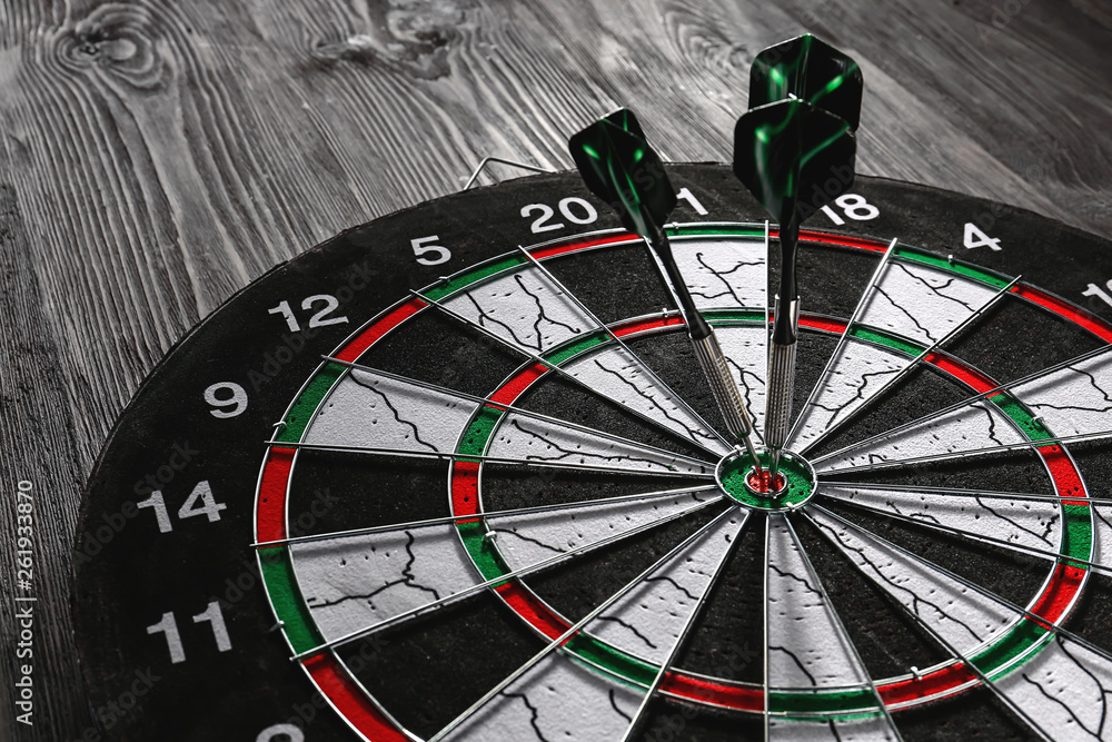 Dartboard with hit bullseye, closeup Dartboard with hit bullseye, closeup