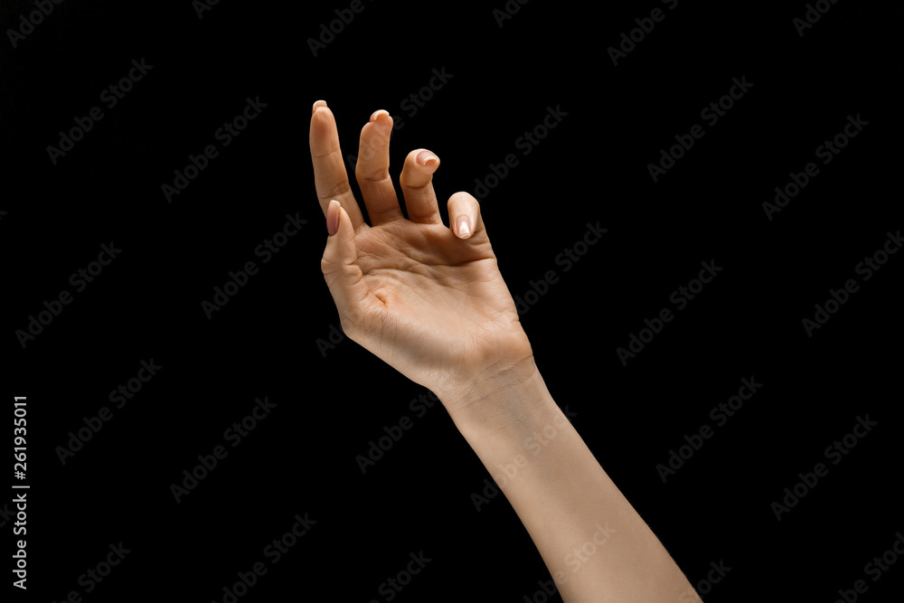 Touching of night. Female hand demonstrating a gesture of getting touch isolated on black studio background. Concept of human emotions, feelings, phycology or business. Touching of night. Female hand demonstrating a gesture of getting touch isolated on black studio background. Concept of human emotions, feelings, phycology or business.