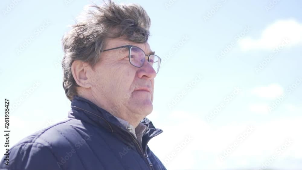 An elderly man enjoys a beautiful view. Close-up An elderly man enjoys a beautiful view. Close-up