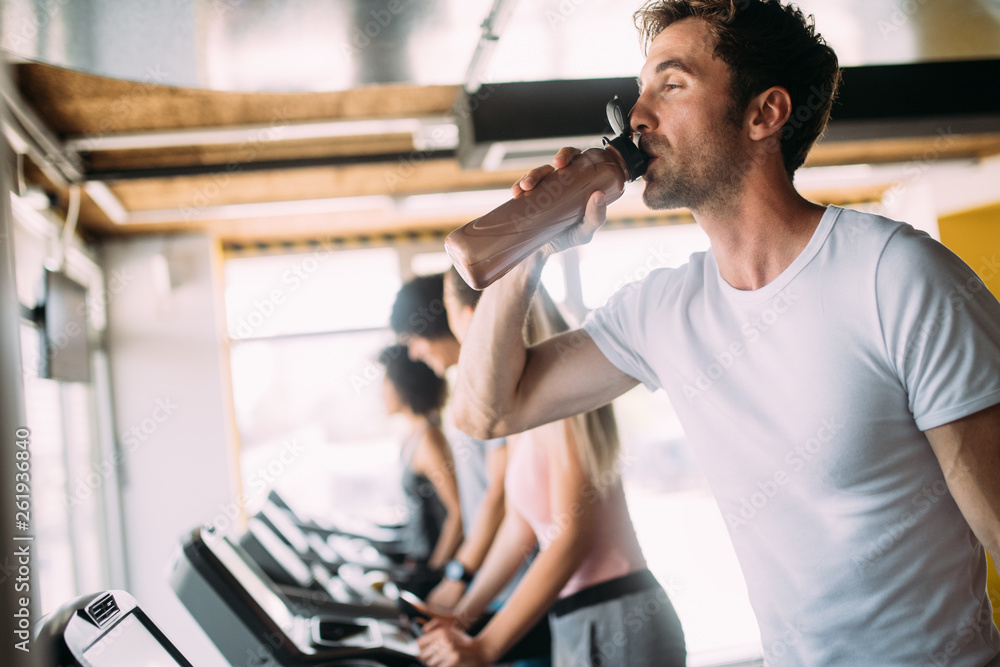 Group of multiethnic sports people make sport exercise in gym Group of multiethnic sports people make sport exercise in gym