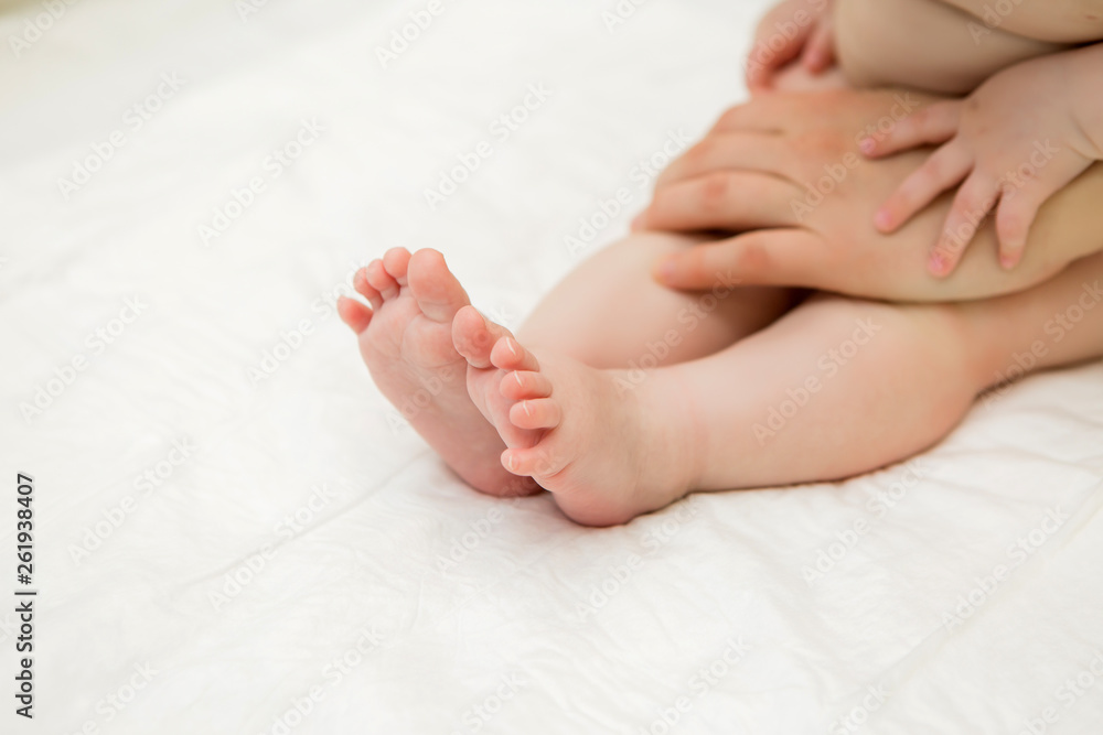 baby massage,doctor massaging or doing gymnastics baby,Mother or therapist makes massage to her baby at home. Health care and medicine concept baby massage,doctor massaging or doing gymnastics baby,Mother or therapist makes massage to her baby at home. Health care and medicine concept