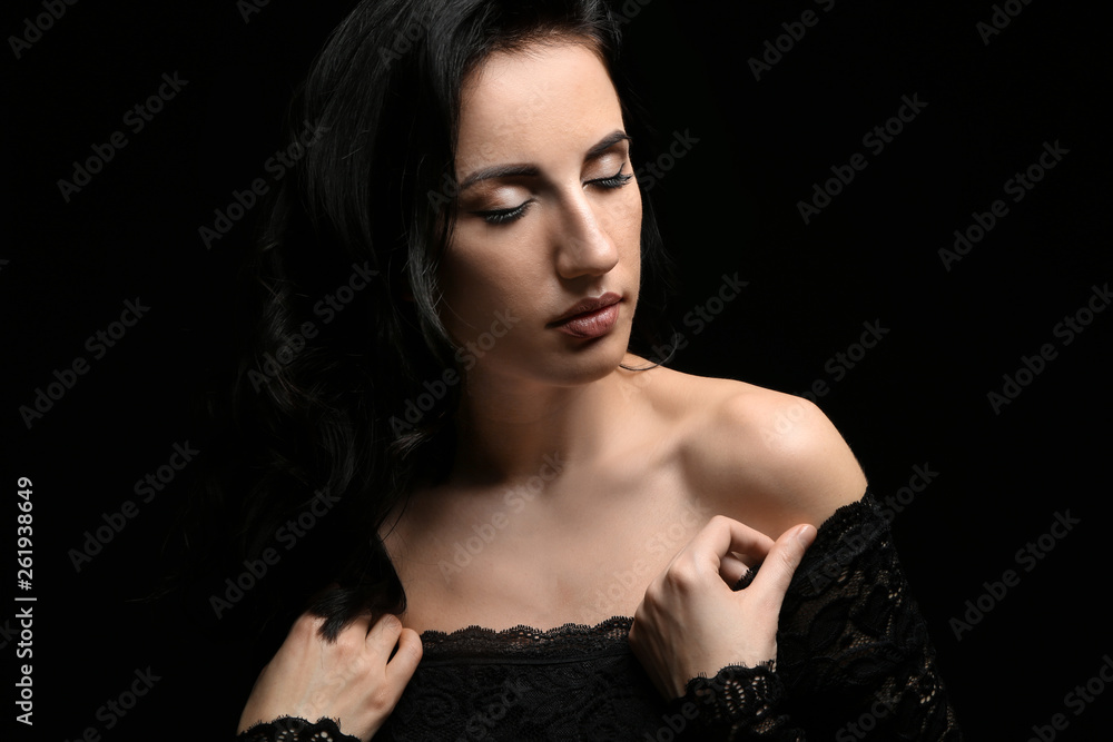 Portrait of beautiful woman on dark background Portrait of beautiful woman on dark background