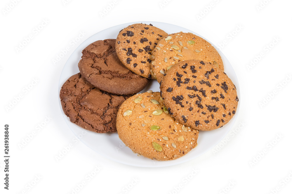 Various drop cookies on dish on a white background