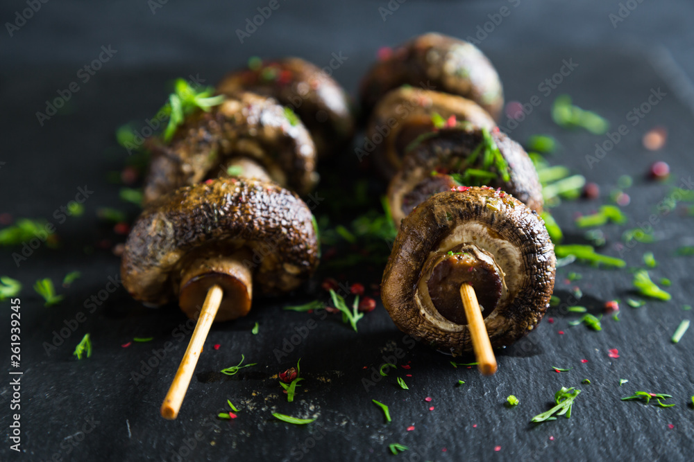 Grilled champignons on skewer Grilled champignons on skewer