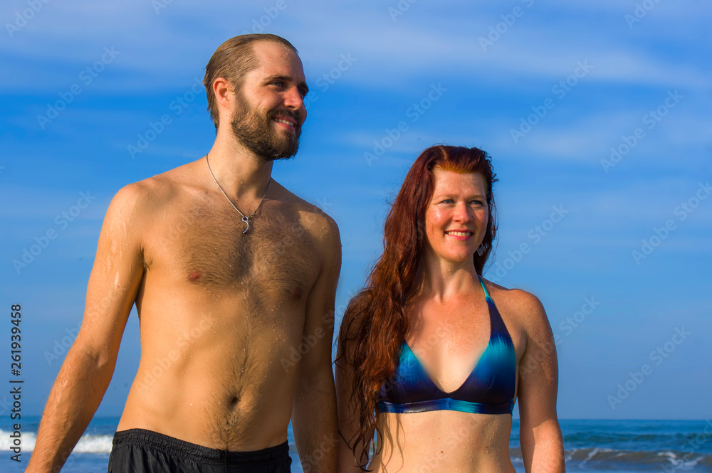 happy and beautiful couple enjoying Summer holidays travel or honeymoon trip together in tropical paradise beach having fun relaxed and playful on the sea happy and beautiful couple enjoying Summer holidays travel or honeymoon trip together in tropical paradise beach having fun relaxed and playful on the sea