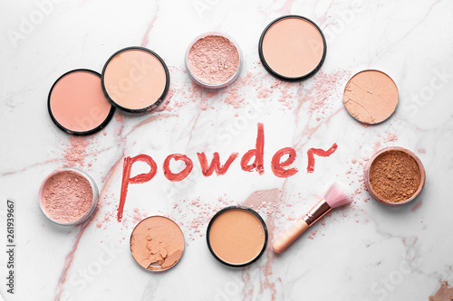 Composition with facial powder on light background