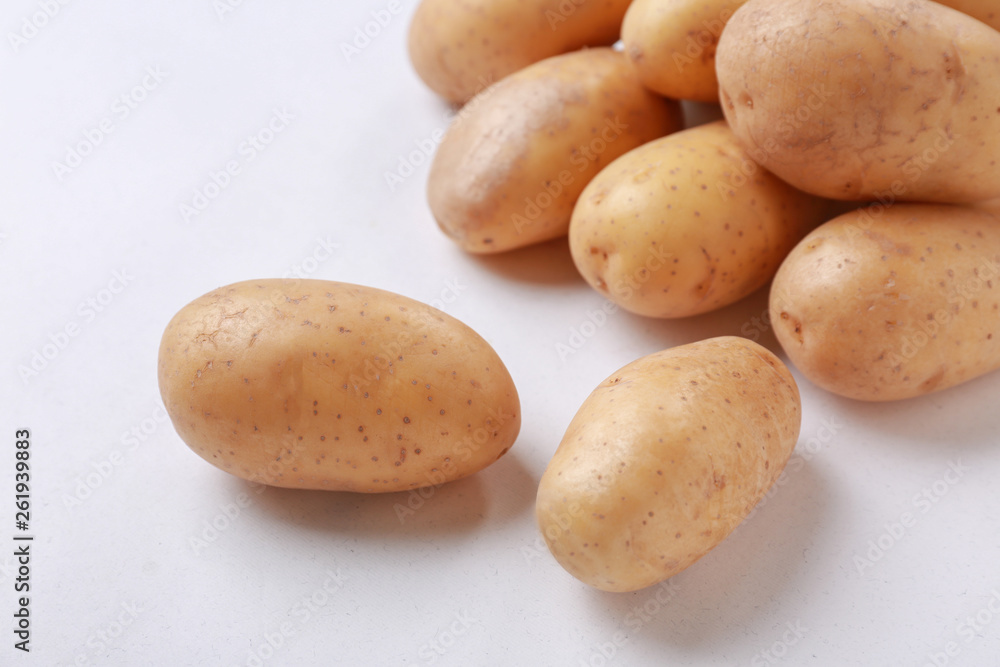 Raw potatoes on white background Raw potatoes on white background