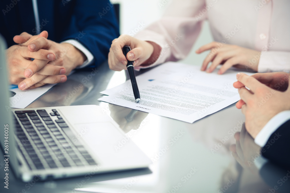 Group of business people and lawyers discussing contract papers. Success at meeting or negotiation Group of business people and lawyers discussing contract papers. Success at meeting or negotiation