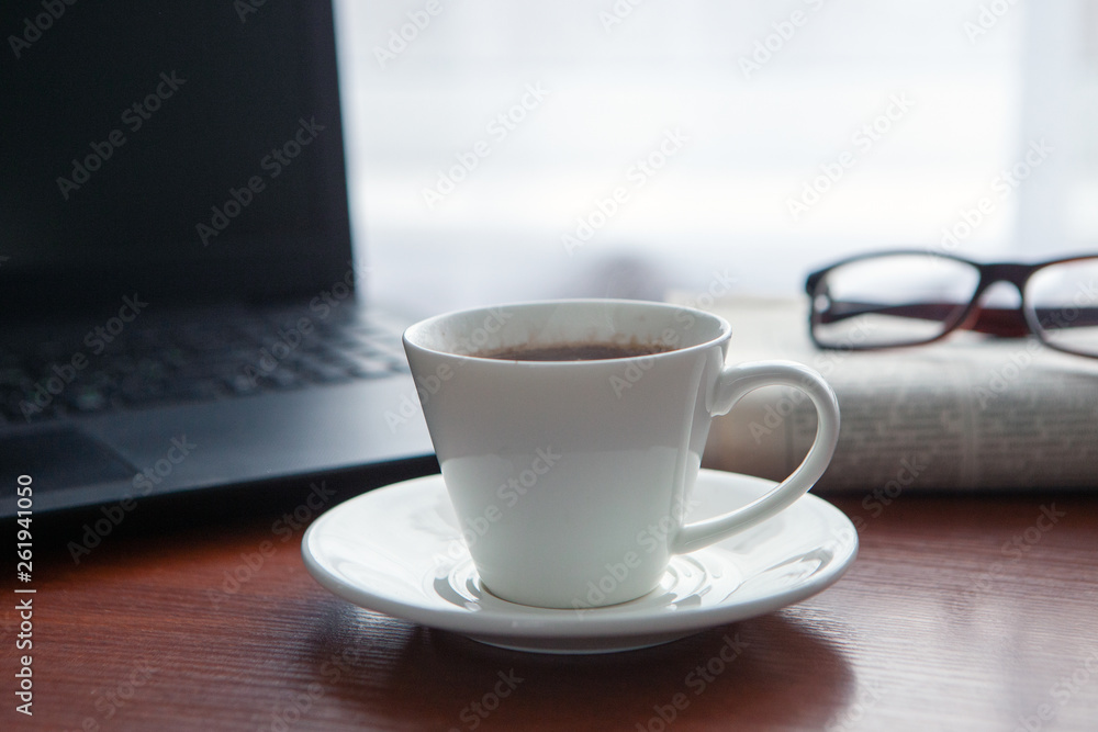 Newspaper with computer on table. Coffee break. Newspaper with computer on table. Coffee break.