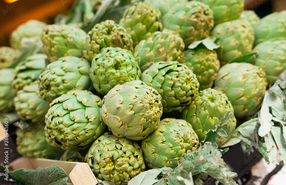 Fresh artichokes on market counter Fresh artichokes on market counter