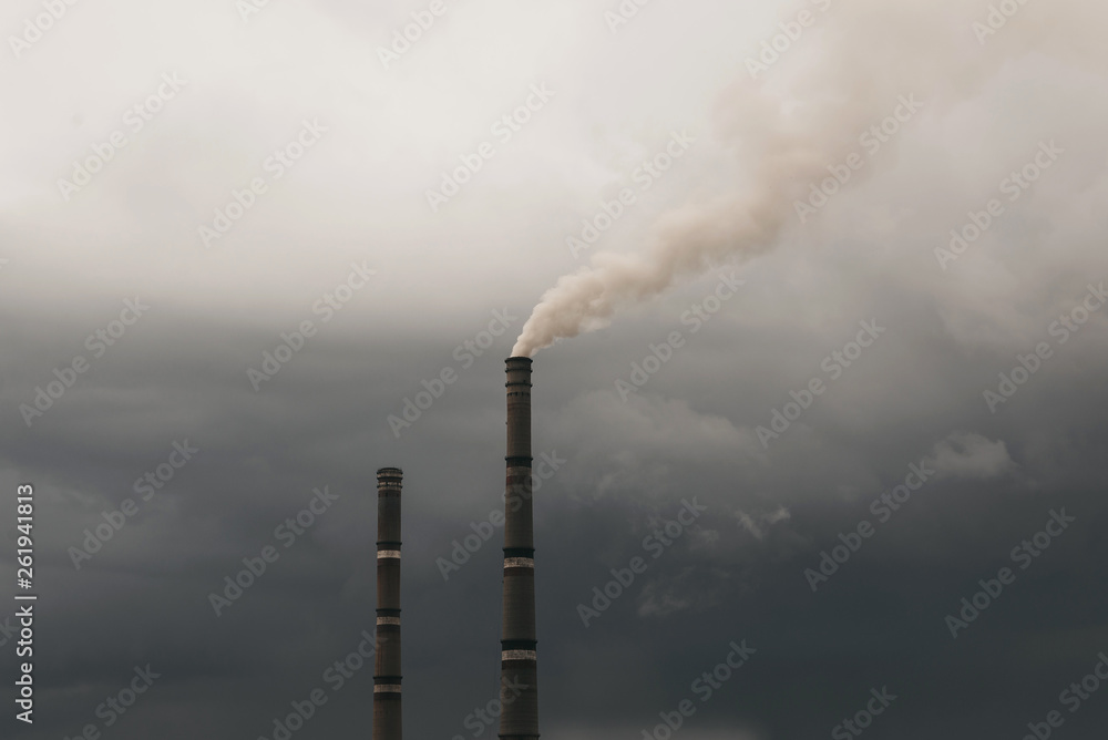 Industrial smoke emissions from chimneys on dark cloud sky background. Industrial smoke emissions from chimneys on dark cloud sky background.