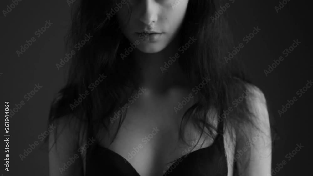Closeup portrait of a beautiful girl. Black and white video. Closeup portrait of a beautiful girl. Black and white video.