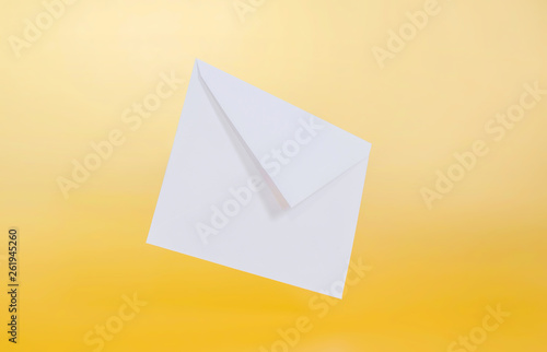 Blank white paper envelope on a single-colored background