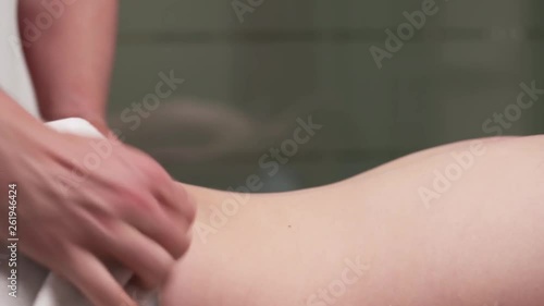 Wallpaper Mural A professional therapist preparing a patient for back massage. Sport and rehabilitation concept. Torontodigital.ca