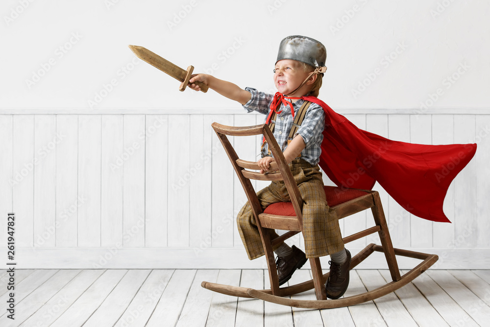 Little boy plays the knight - obrazy, fototapety, plakaty 