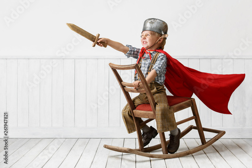 Foto Little boy plays the knight