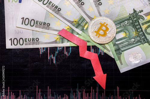 unprofitable investment of depreciation of virtual money bitcoin. Red arrow, silver bitcoin and euro go down on paper forex chart index background. Concept of depreciation of cryptocurrency.
