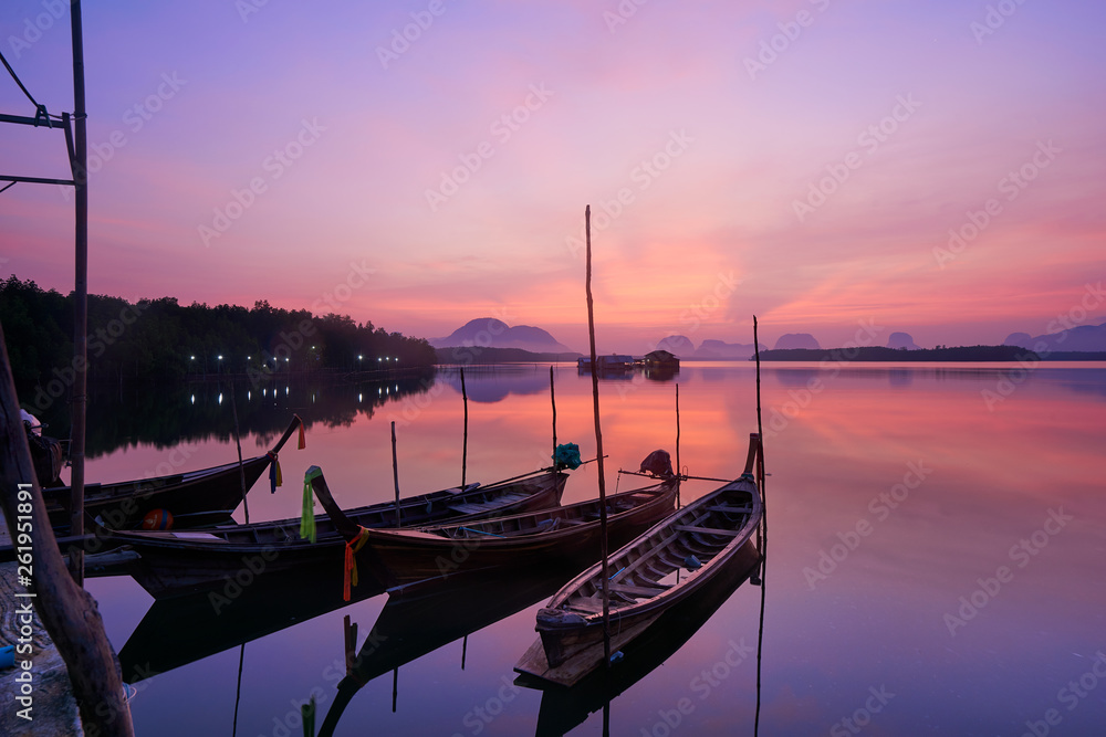 Beautiful sky in the morning during sunrise and fisherman longtail boats