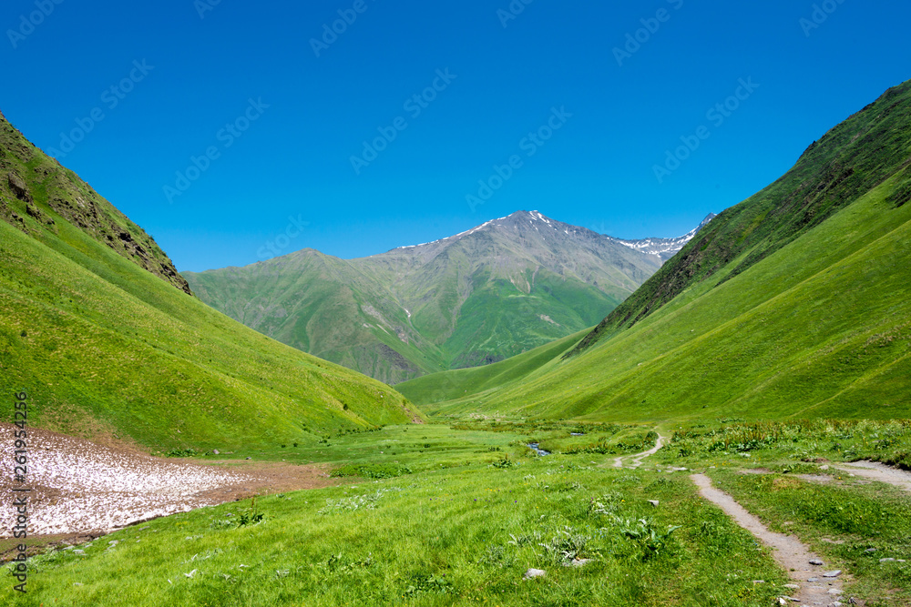 Fototapeta premium Kazbegi, Georgia - Jul 03 2018: Mountain hut at Juta valley near Caucasus mountain. a famous landscape in Kazbegi, Mtskheta-Mtianeti, Georgia.