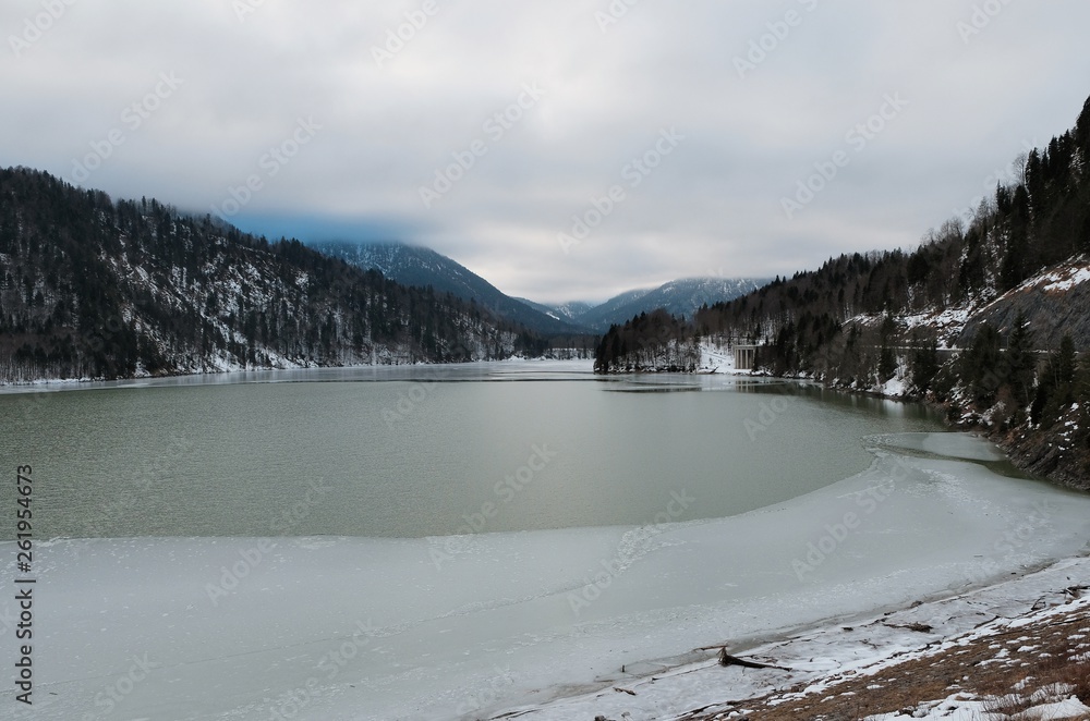 Obraz premium Aerial view on the lake Sylvenstein and bridge in the Alps of Bavaria in winter. Germany, january 2018