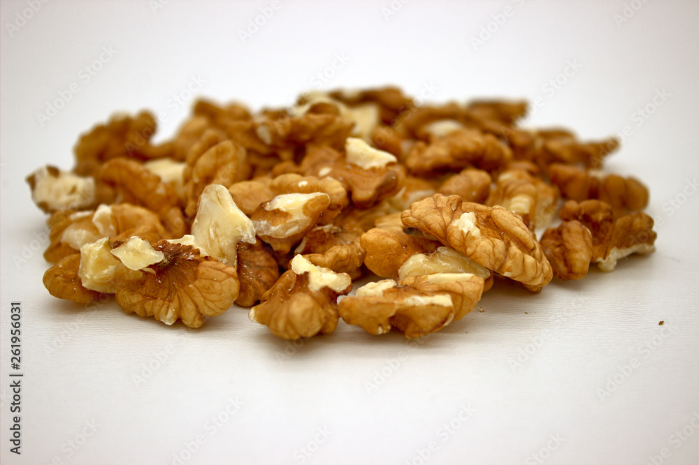 Walnut Kernels (Other Names: Juglans Regia, Persian Walnut, English Walnut, Circassian Walnut). Isolated Image On A White Background Walnut Kernels (Other Names: Juglans Regia, Persian Walnut, English Walnut, Circassian Walnut). Isolated Image On A White Background