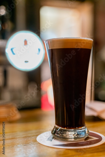 Close up shot of a glass of dark beer