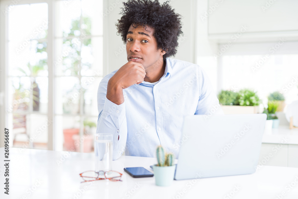 African American business man working using laptop serious face thinking about question, very confused idea African American business man working using laptop serious face thinking about question, very confused idea