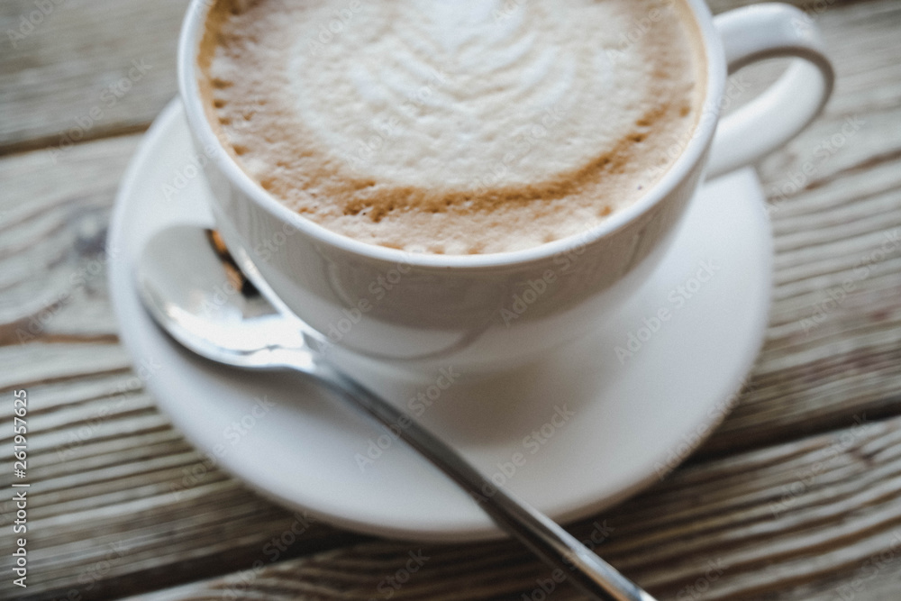 cup of coffee on wooden table cup of coffee on wooden table