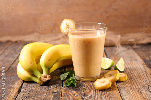 banana smoothie on wood background
