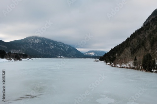 Aerial view on the lake Sylvenstein and bridge in the Alps of Bavaria in winter. Germany, january 2018 photo