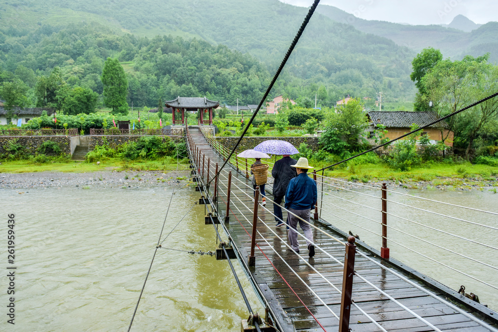 Ancient Chinese Suspension Bridge Architecture in Rainy Days