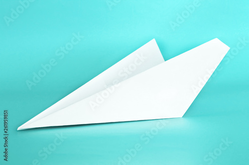 White paper plane on pastel blue color background