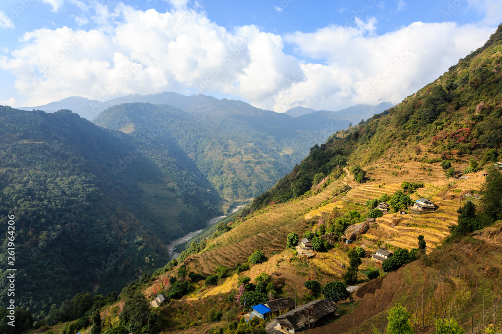 Small asian mountain village and terrace fields in autumn in Nepal, Himalaya, Annapurna Conservation Area