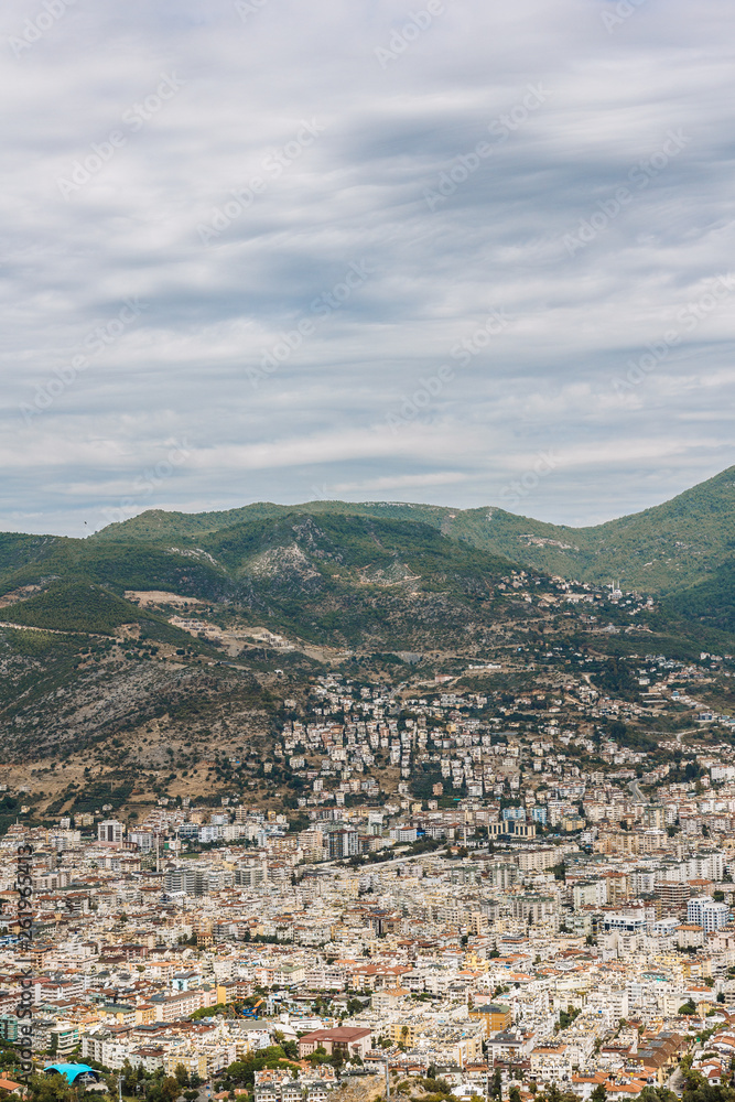 city with mountains in the background. Turkey, Alanya. Top view. Vertical