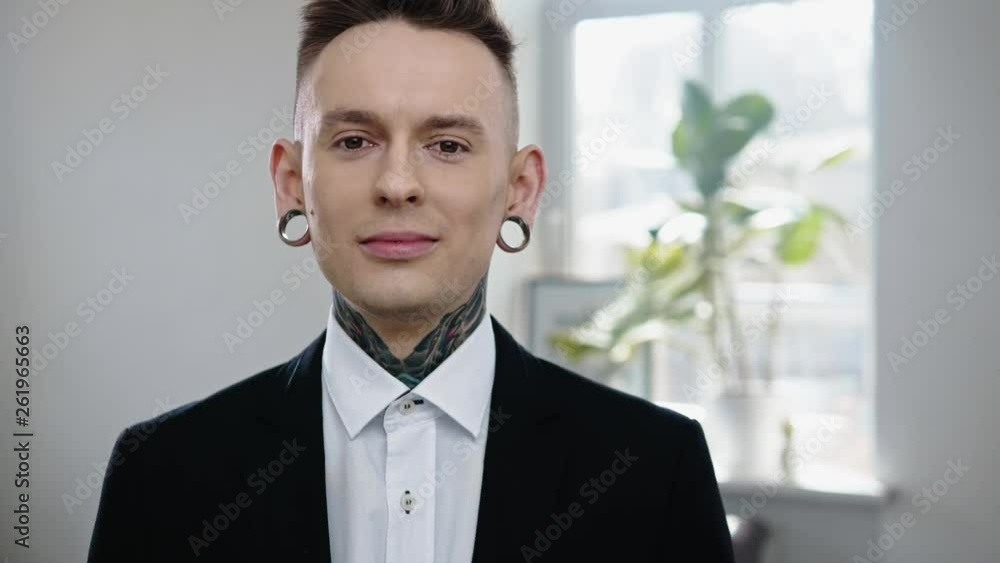 Portrait of alternative model with earplugs and tattoo Portrait of alternative model with earplugs and tattoo